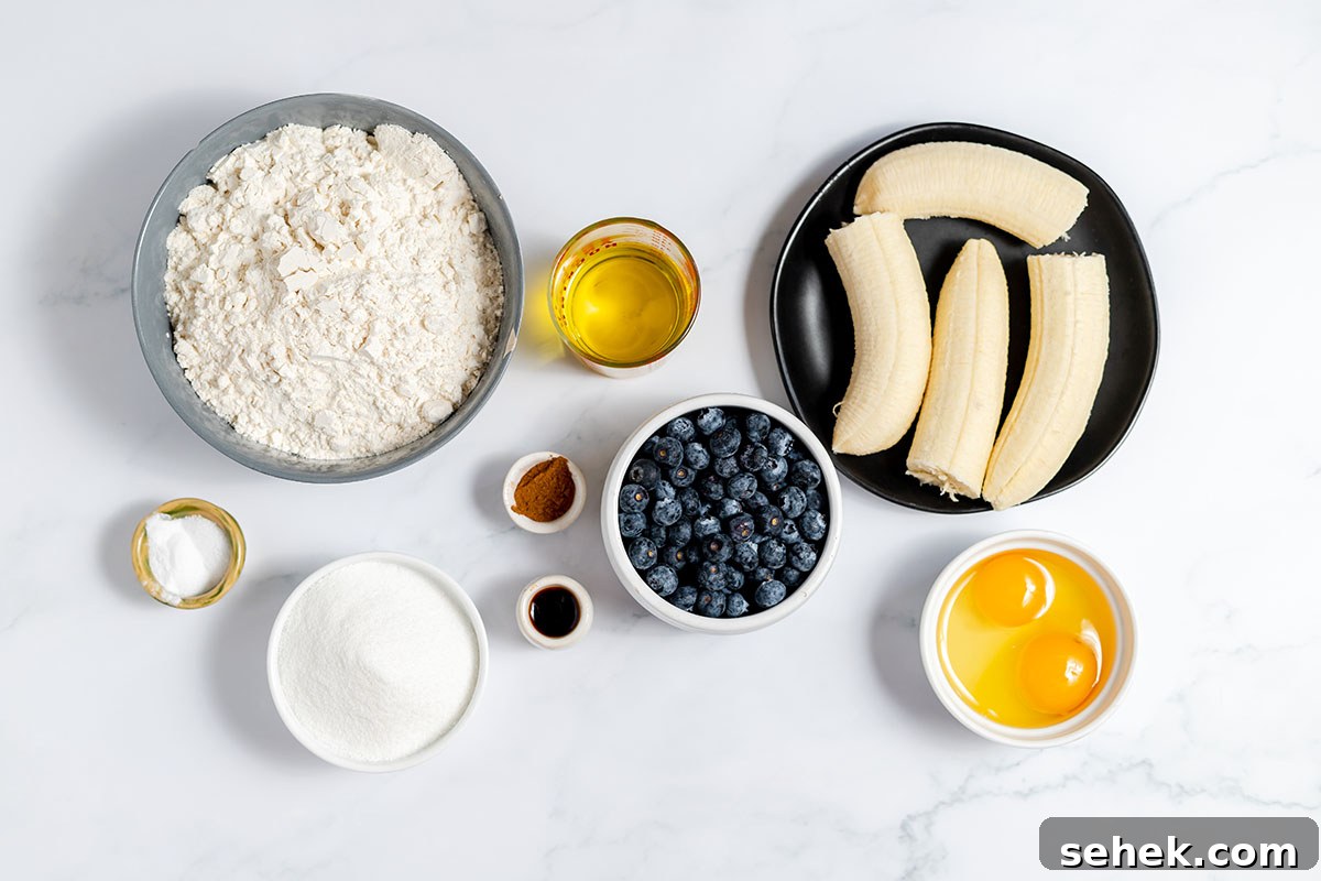 Moist Blueberry Banana Bread Recipe with Lemon Glaze 3 Ingredients to make Blueberry Banana Bread set out on the counter.