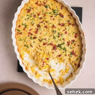 Cheesy Corn Casserole served in a casserole dish.
