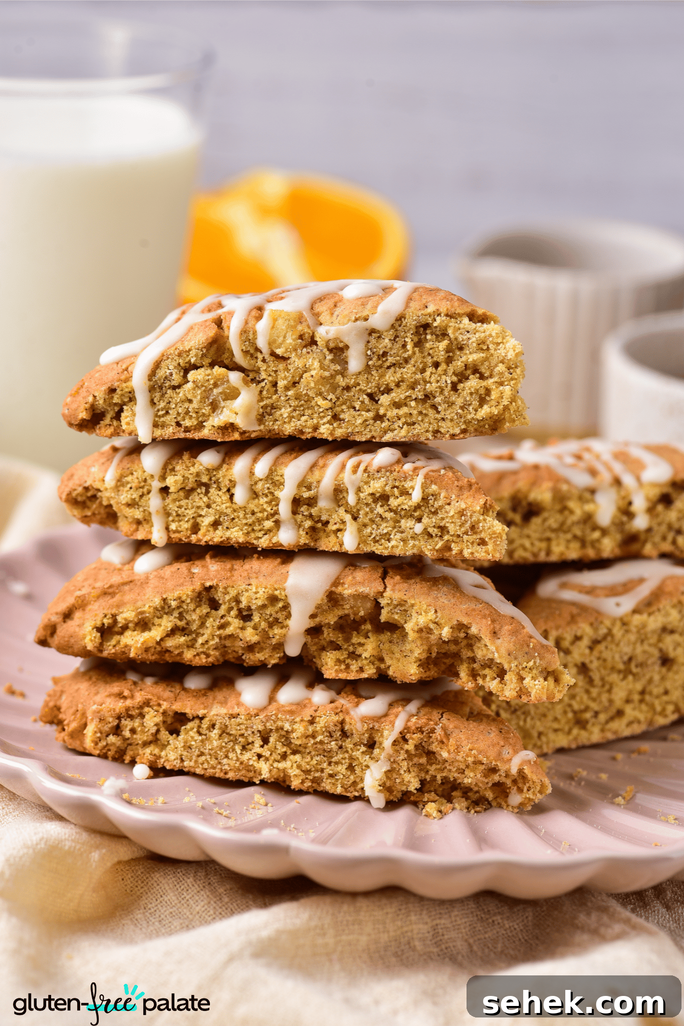 Gluten-Free Pumpkin Scones Recipe for Moist, Flaky Bakes 8 gluten-free pumpkin scones on a pink serving plate.