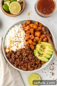Spicy Honey Beef Bowls with Garlic Rice and Crispy Veggies 19 A bowl with ground beef, cottage cheese, and sweet potatoes.