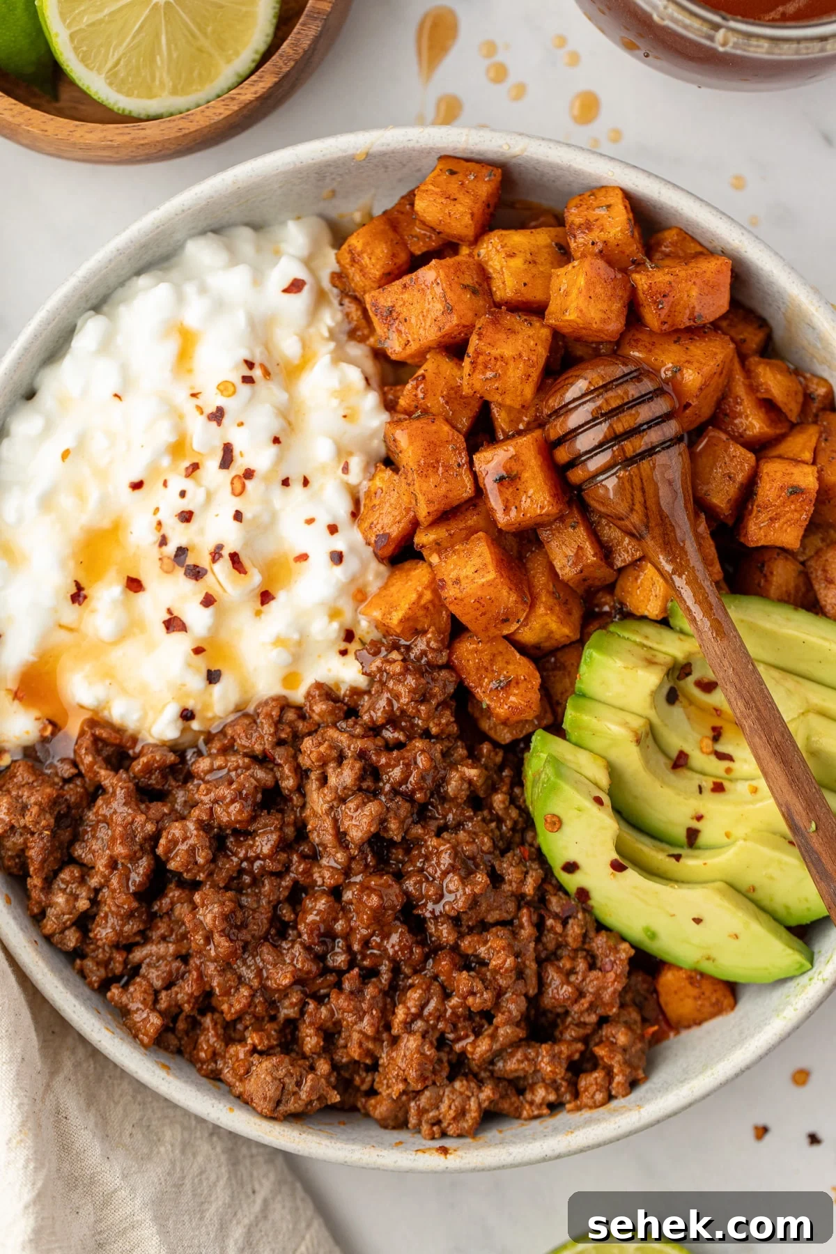 Spicy Honey Beef Bowls with Garlic Rice and Crispy Veggies 10 A protein bowl with ground beef, cottage cheese, and avocado.