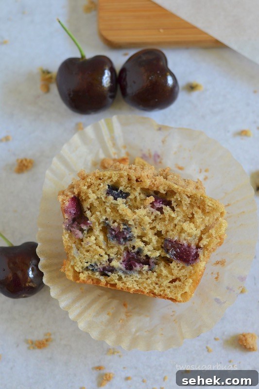 Cherry Crumble Muffins Recipe — Classic Cherry Streusel Muffins 4 Cross section of a cherry crumble muffin