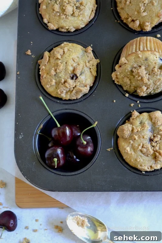 Cherry Crumble Muffins Recipe — Classic Cherry Streusel Muffins 9 overhead shot of muffins in a muffin tin