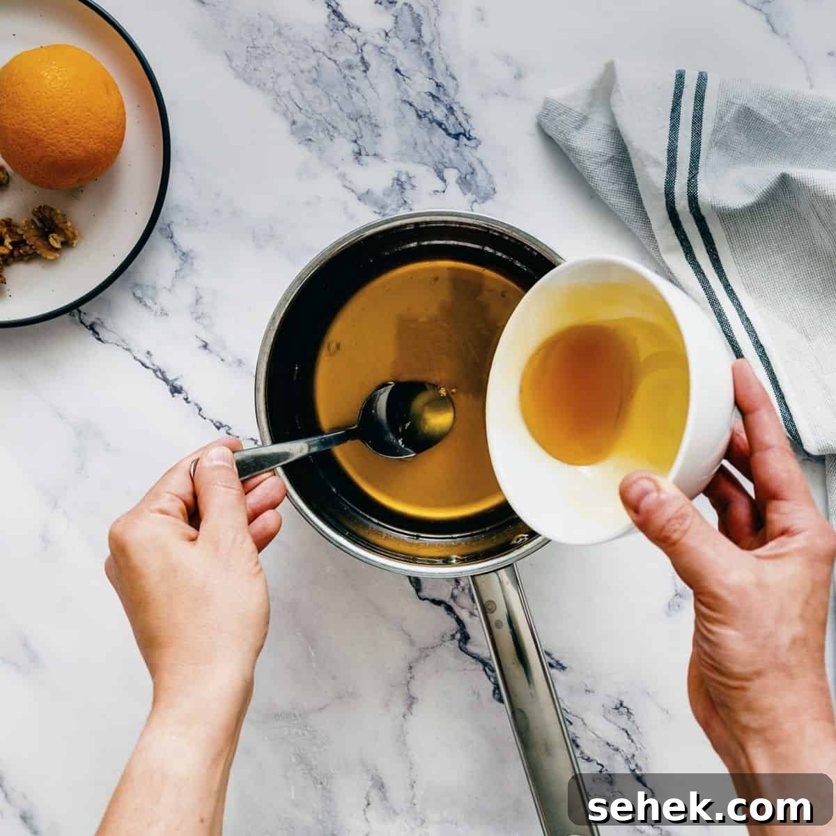 Melomakarona Greek Christmas Honey Cookies Recipe 4 making a honey sugar syrup for Greek honey cookies.