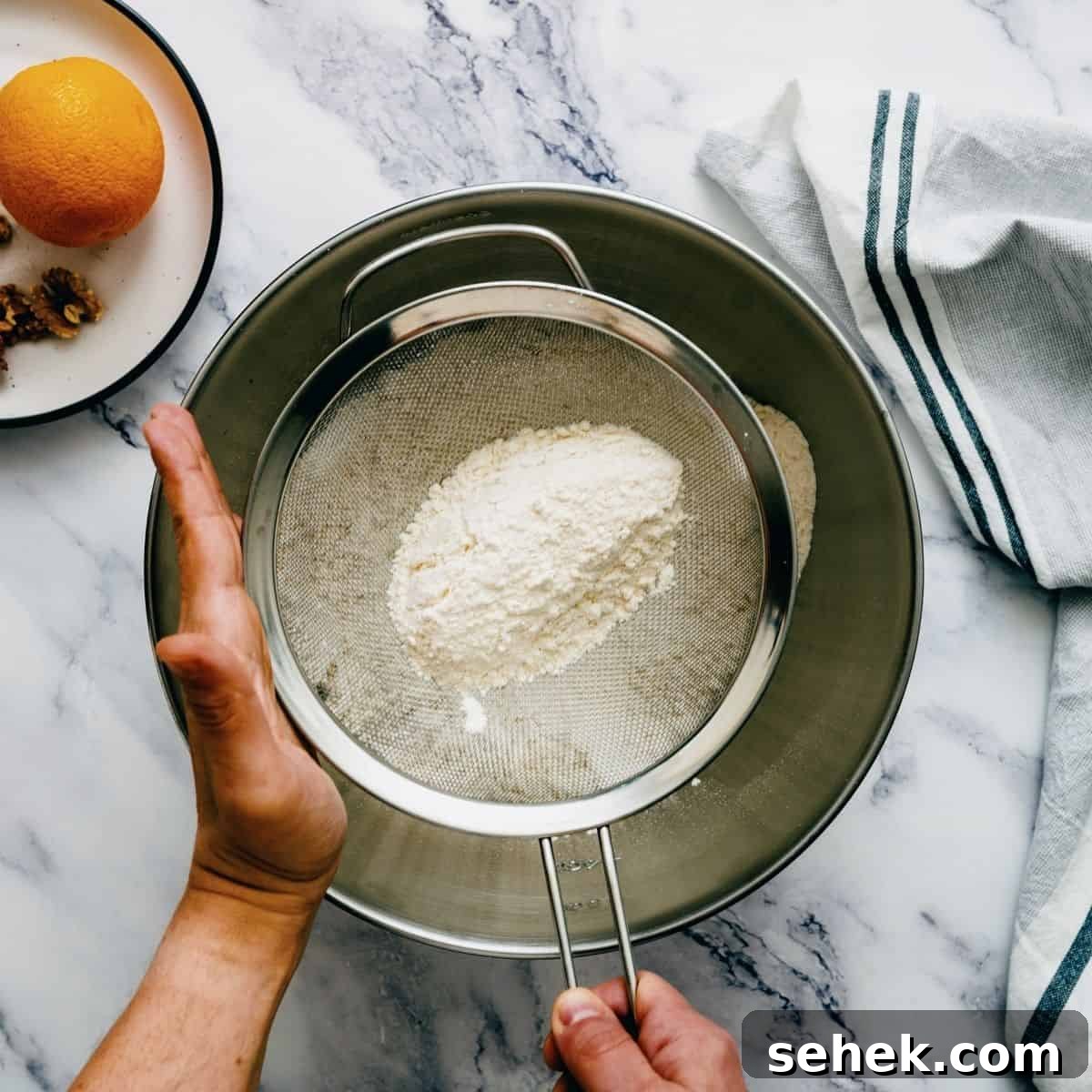 Melomakarona Greek Christmas Honey Cookies Recipe 6 sifting flour into a large stainless steel bowl.