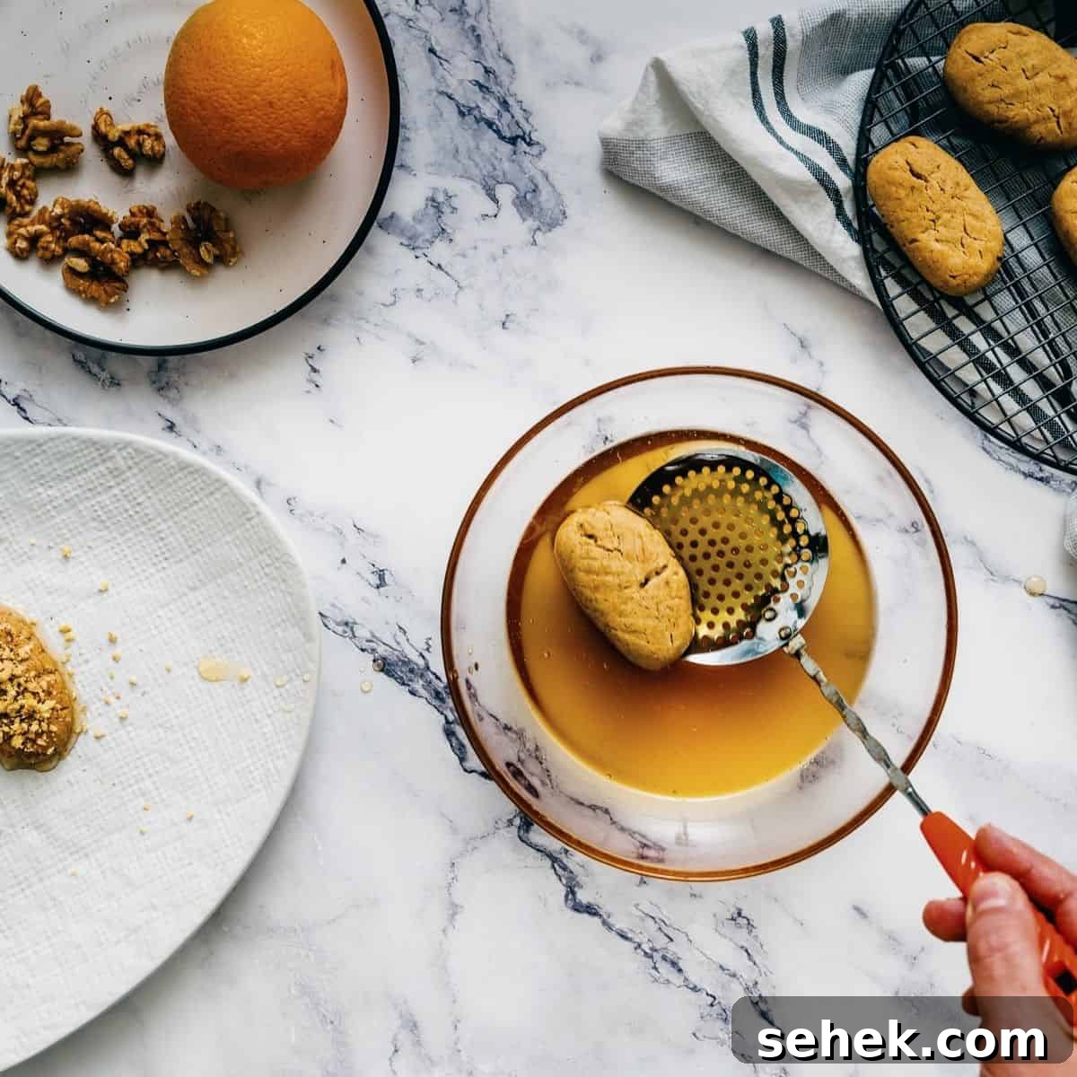 Melomakarona Greek Christmas Honey Cookies Recipe 10 dipping the melomakarona cookies into a honey syrup.