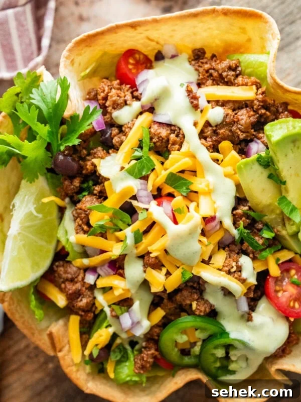 Chipotle-Style Pollo Asado Recipe: Juicy Mexican Grilled Chicken 16 A fully dressed taco bowl with garnish.