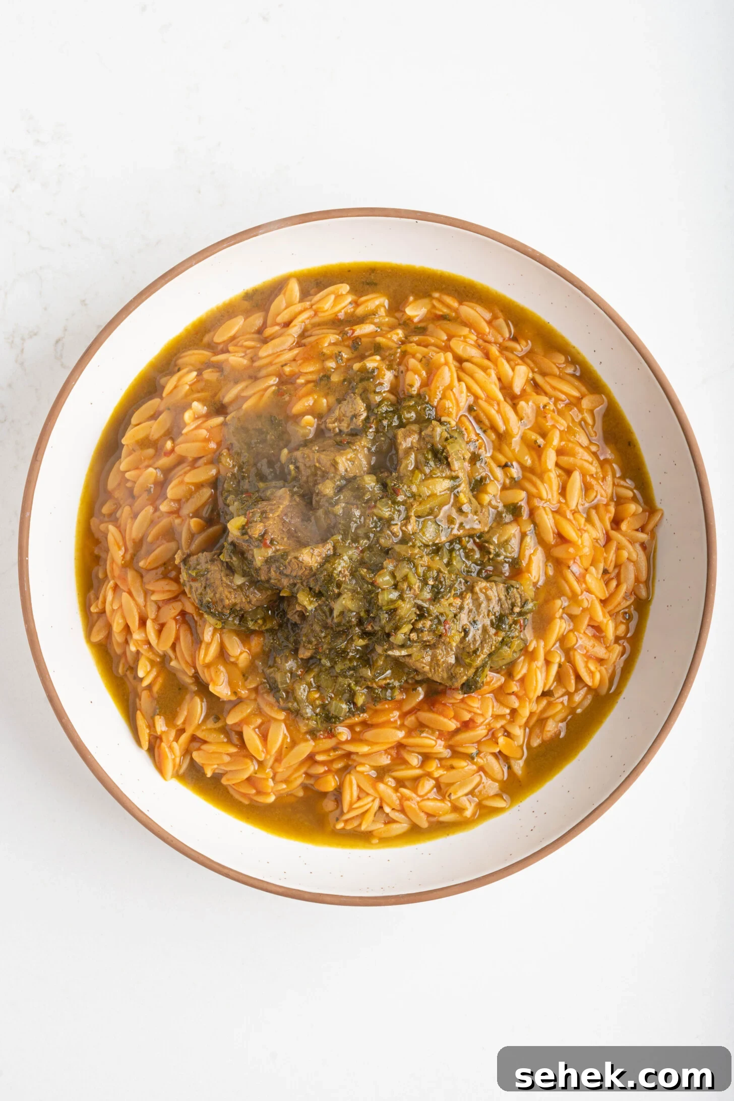 Moroccan Lamb and Orzo Recipe with Warm Spices 9 a bowl of orzo with lamb