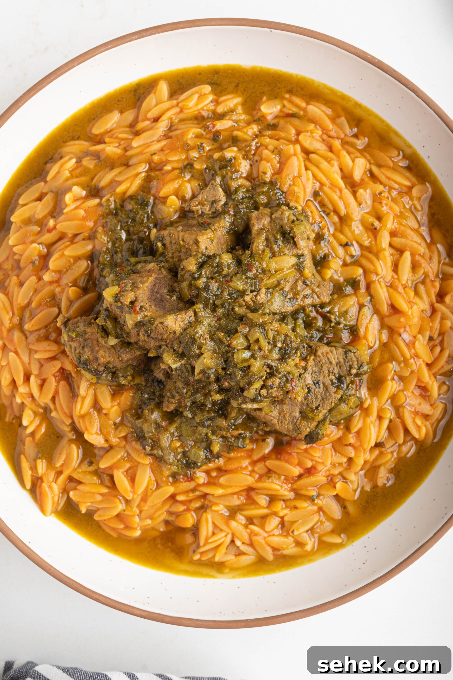Moroccan Lamb and Orzo Recipe with Warm Spices 10 a bowl of orzo with lamb