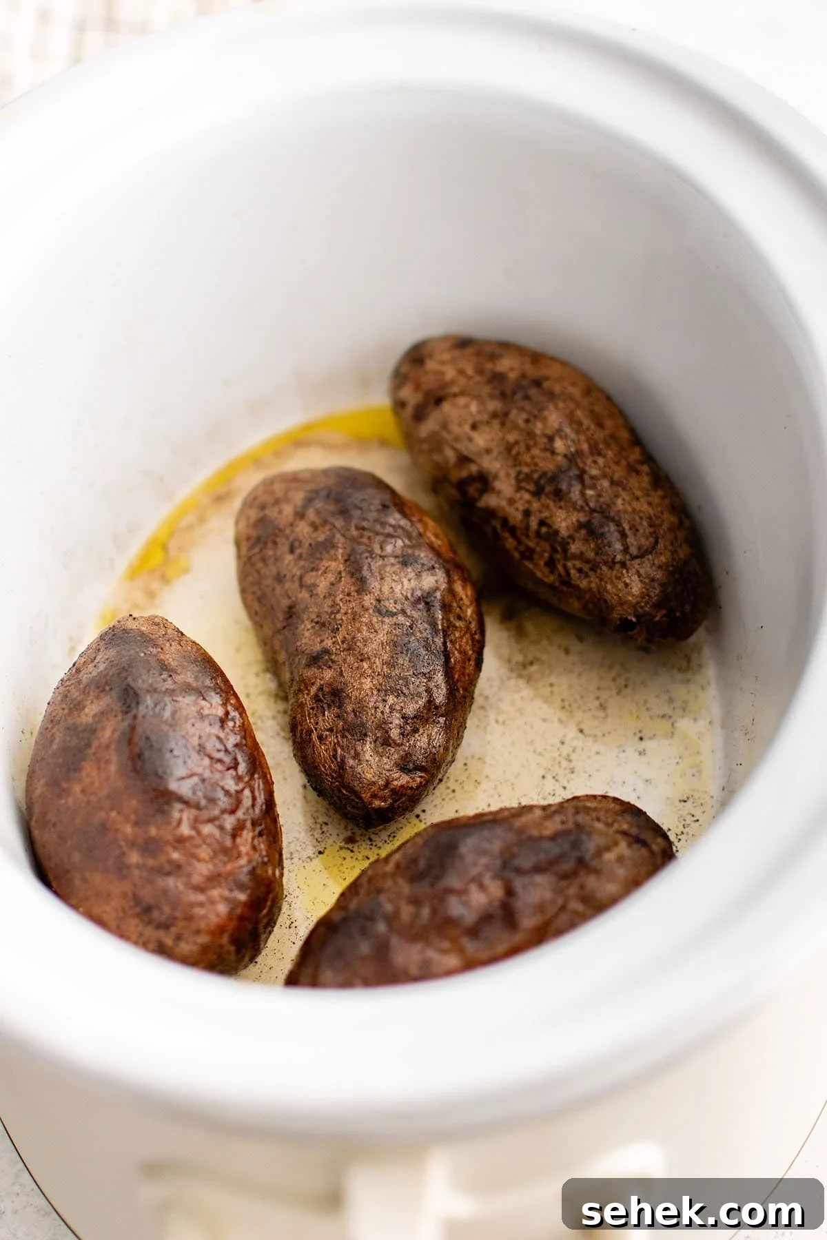 photo of baked potatoes in the slow cooker