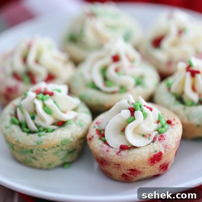 These colorful Christmas Sprinkle Cookie Cups are a delicious and easy to make Christmas Cookie. #christmas #cookie #recipe #dessert #holiday #sprinkles