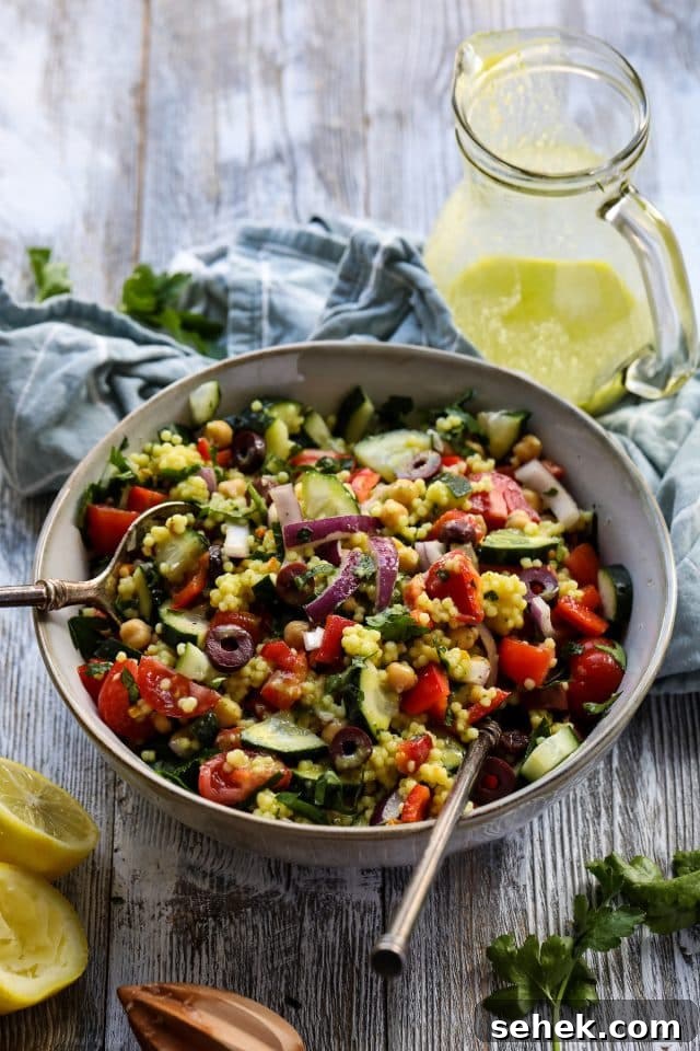 Vibrant Vegan Couscous Salad with Roasted Veggies and Herbs 6 Israeli couscous salad with lemon garlic dressing.