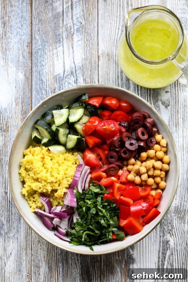 Vibrant Vegan Couscous Salad with Roasted Veggies and Herbs 7 Mediterranean couscous salad with lemon garlic dressing.