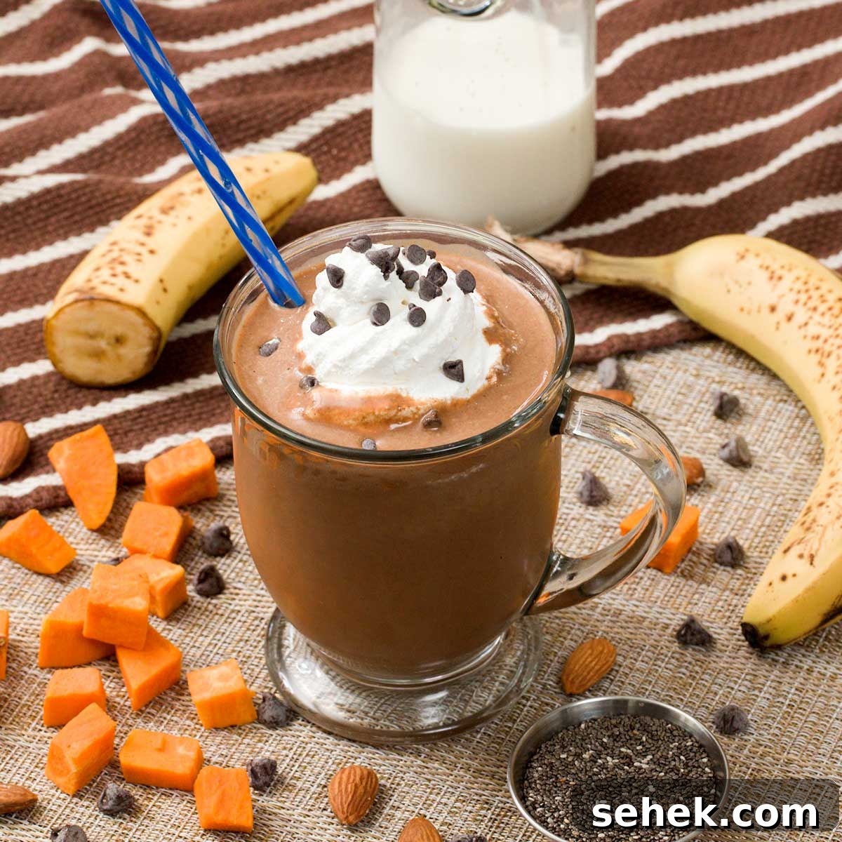 High-Protein Chocolate Sweet Potato Smoothie Recipe 2 Chocolate sweet potato smoothie with whipped cream on top.