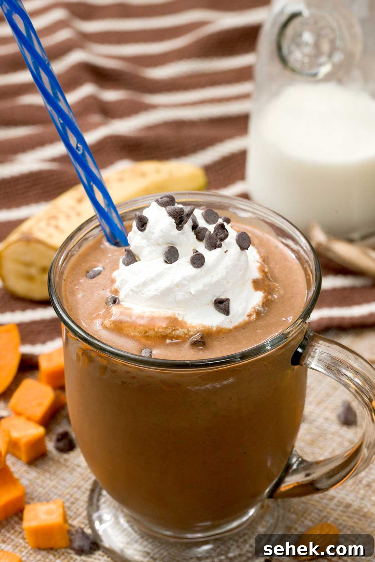 High-Protein Chocolate Sweet Potato Smoothie Recipe 3 Chocolate sweet potato smoothie with whipped cream on top.