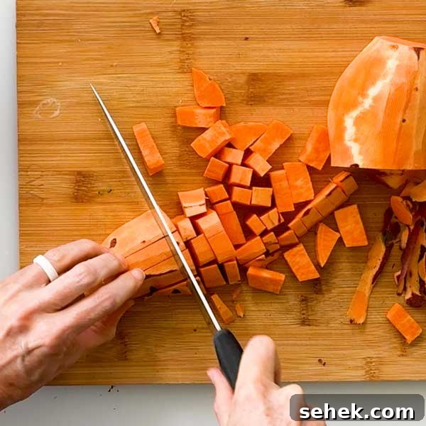 High-Protein Chocolate Sweet Potato Smoothie Recipe 5 Dicing sweet potatoes into half-inch pieces.