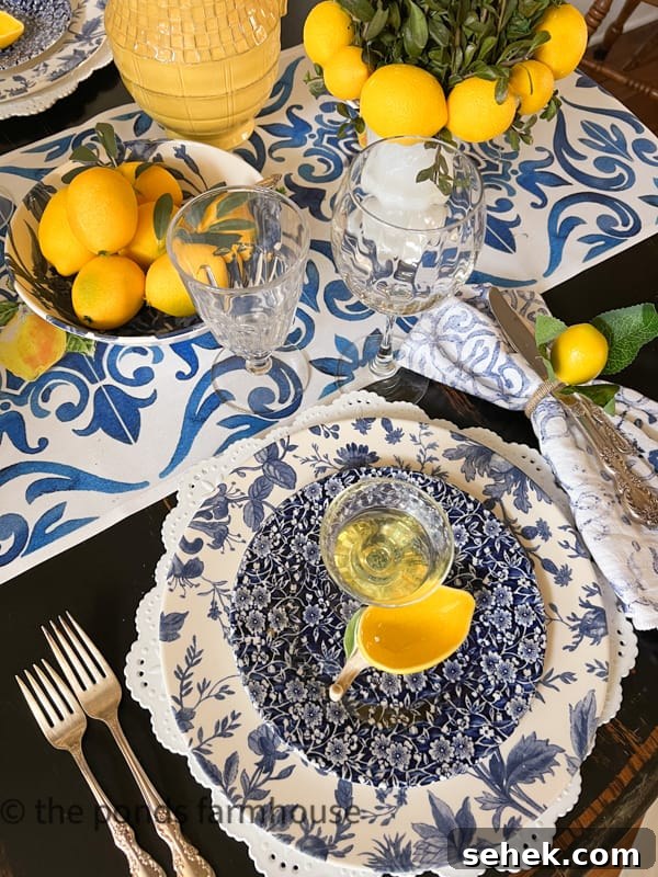 Italian-Inspired Tablescape Ideas for Elegant Dinner Parties 11 place setting with blue floral accessories and lemons