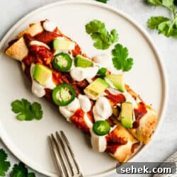 This epic Vegan Enchiladas with Black Beans and Kale recipe is a creamy, satisfying and wholesome plant-based meal. Kid approved and gluten-free!