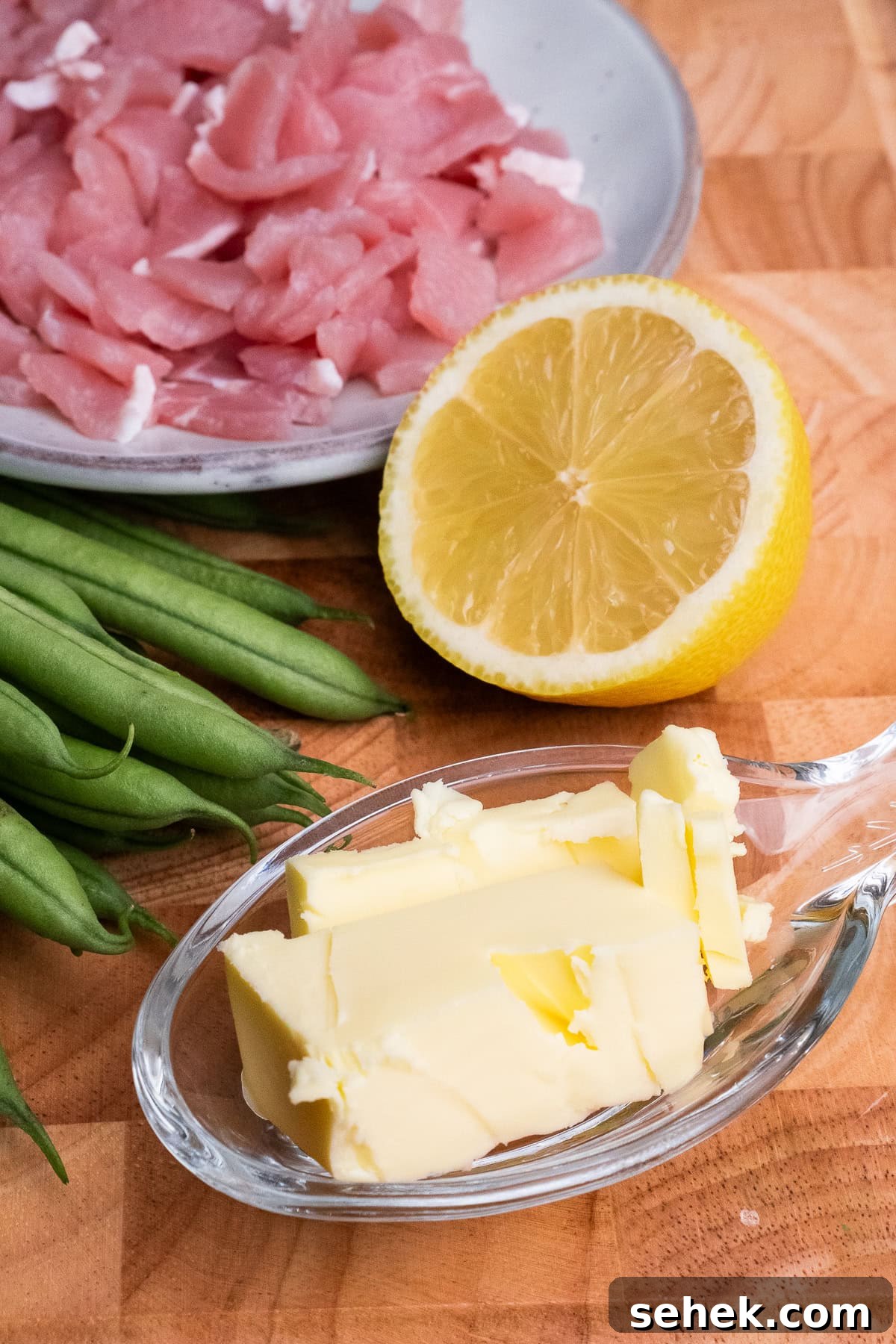 Garlic Green Beans with Crispy Bacon and Lemon Zest 19 Unsalted butter in a glass dish