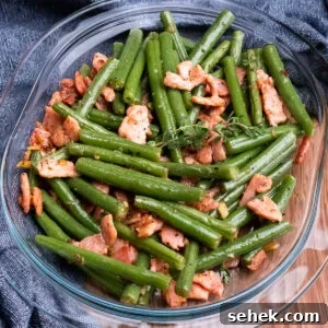 Garlic Green Beans with Crispy Bacon and Lemon Zest 4 Garlicky Green Beans and Bacon in a glass dish