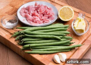 Garlic Green Beans with Crispy Bacon and Lemon Zest 5 Two garlic cloves, butter in a glass dish, salt , pepper , green beans, chopped up bacon and half a lemon a wooden board