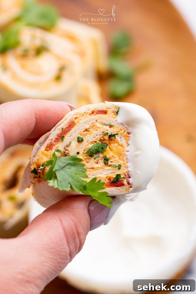 Chicken Enchilada Roll Ups are the perfect appetizer or snack for any party or occasion. This make-ahead appetizer is made with easy-to-find ingredients like taco seasoning, cream cheese, and shredded chicken (or leftover chicken!).