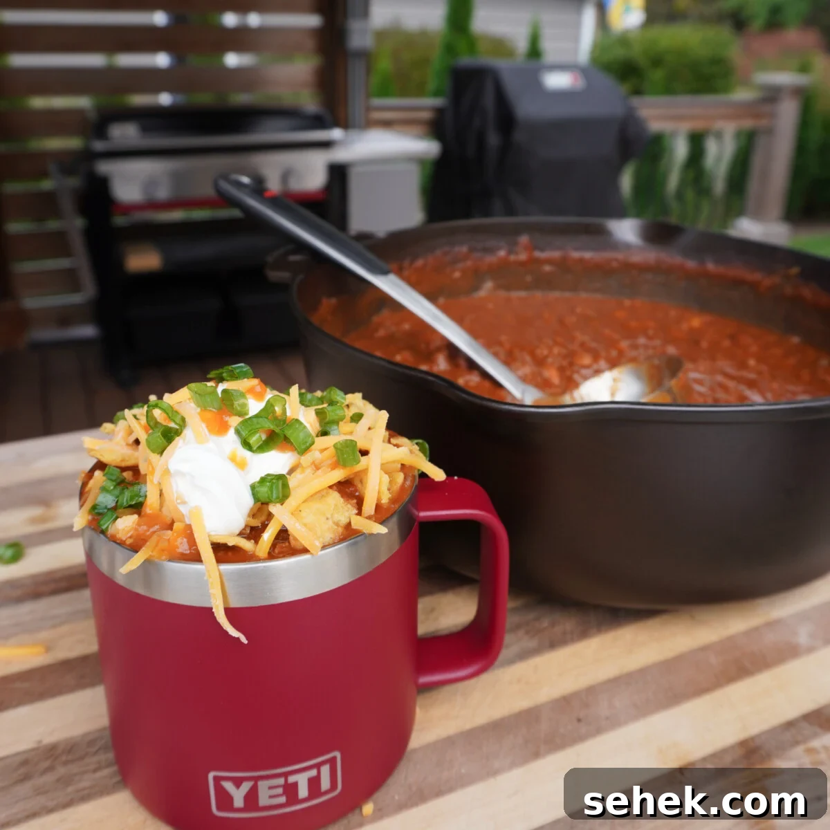 Loaded Beef Chili Recipe: Over-the-Top Comfort Chili 2 Over the top chili in a Yeti mug with all the toppings.