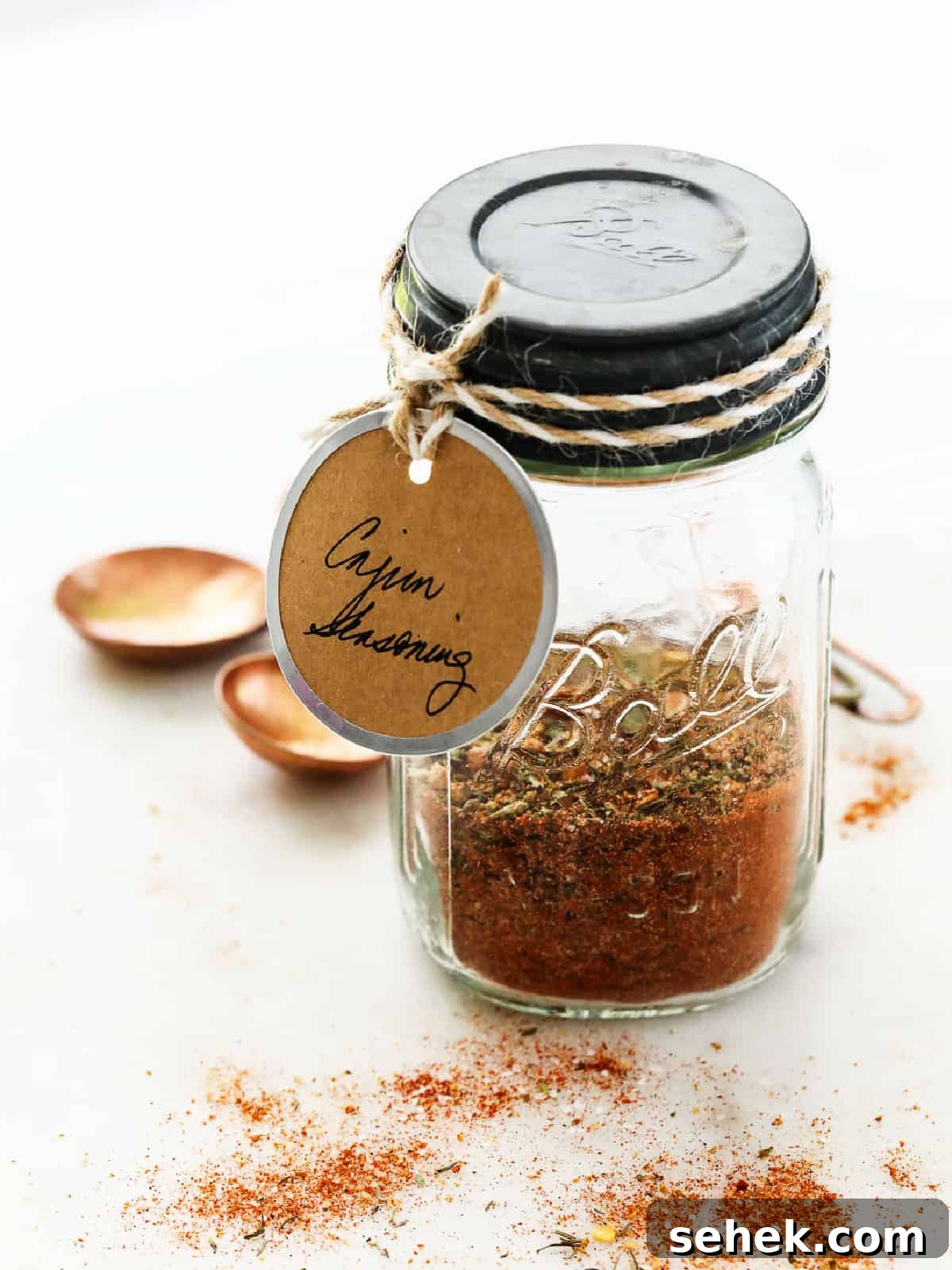 Authentic Cajun Seasoning Mix Recipe for Bold Flavor 4 Cajun seasoning in a Ball jar with a tag