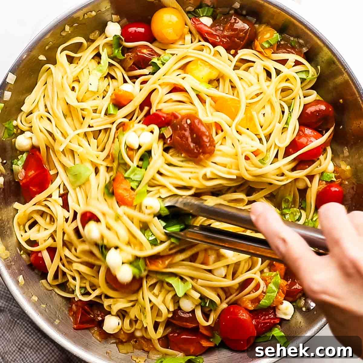 Quick Cherry Tomato Pasta with Garlic and Basil 11 tossing pasta