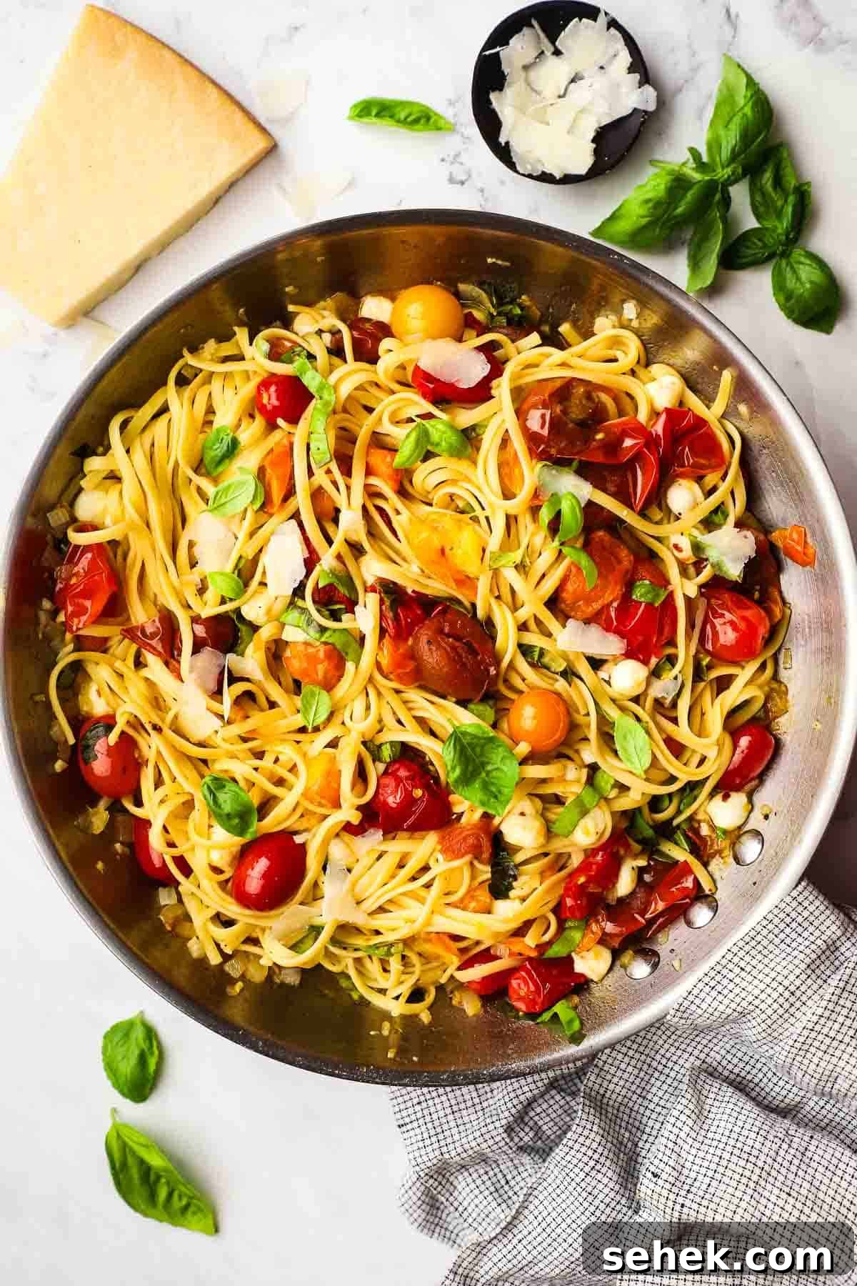 Quick Cherry Tomato Pasta with Garlic and Basil 12 overhead view of a skillet of cherry tomato pasta