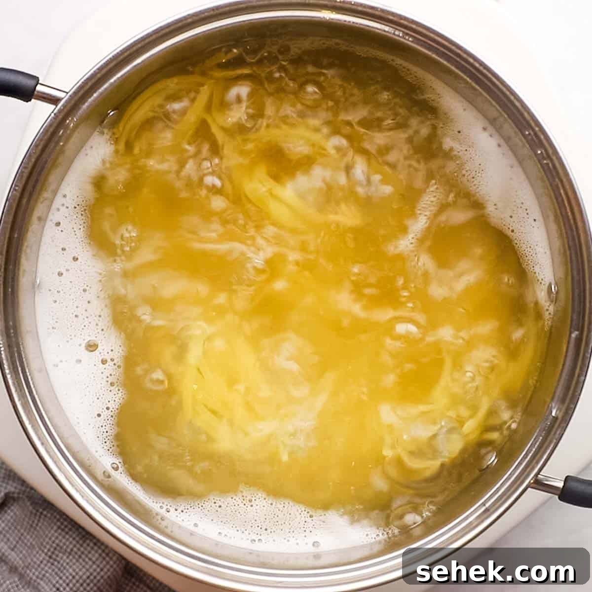 Quick Cherry Tomato Pasta with Garlic and Basil 5 pasta boiling in a large pot