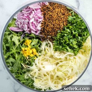 Shaved Fennel & Arugula Salad with Crispy Quinoa Crunch 11 Salad sections with arugula, shaved fennel, thinly sliced onion, crispy quinoa, chopped parsley and lemon zest.