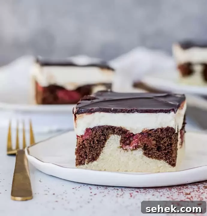 Danube Wave Cake (Donauwellen) – Classic German Layered Dessert 2 slice of Danube waves cake. (donauwellen kuchen) on a plate with a fork next to it