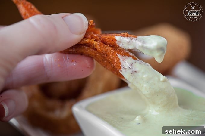 Creamy Green Chile Aioli Recipe for Sandwiches & Tacos 6 Sweet potato fry getting dipped in Green Chile Aioli