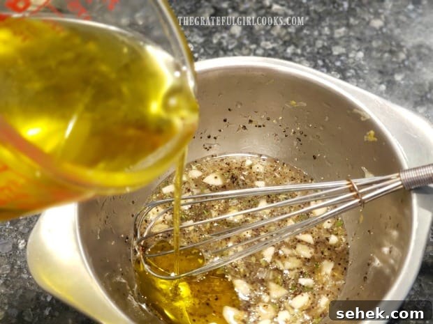 Grilled Lemon Chicken Breasts - The Grateful Girl Cooks! Olive oil is whisked into the lemon marinade until incorporated.