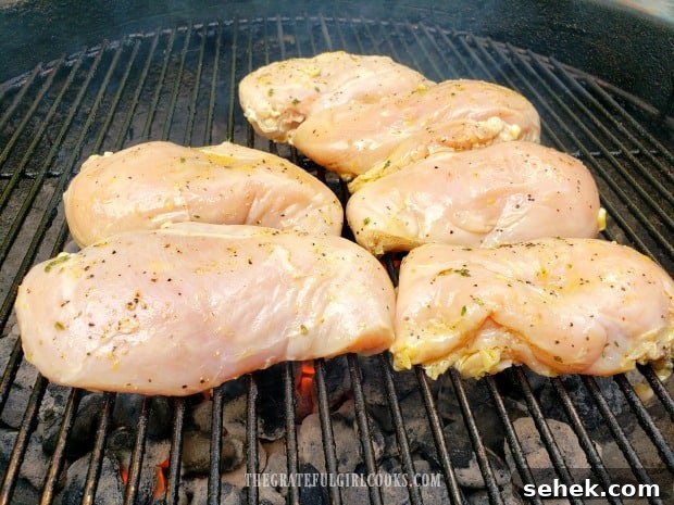 Grilled Lemon Chicken Breasts - The Grateful Girl Cooks! Grilled Lemon Chicken Breasts cooking over hot coals on BBQ.