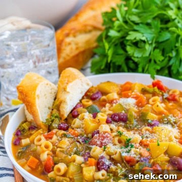 Bowl of soup with slices of bread in bowl.