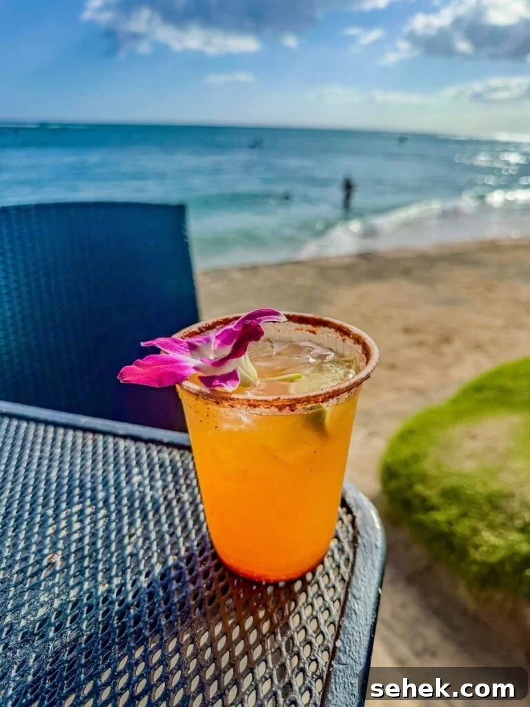 Waikīkī Beach Bar Cocktails with Ocean Views 2 A Li Hing Margarita cocktail at Koa Oasis Booze Shack on Waikīkī Beach.