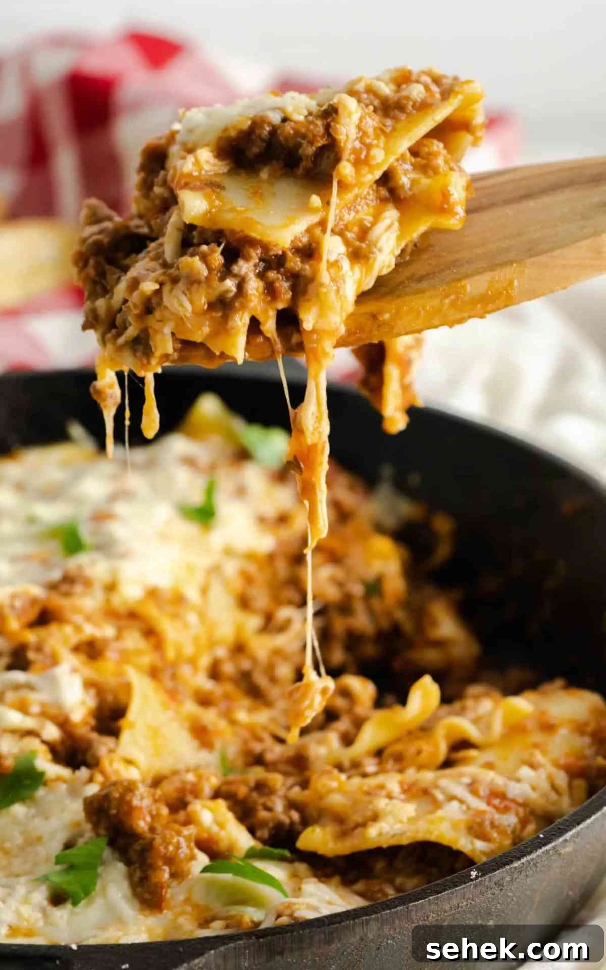 One-Pan Skillet Lasagna: Quick Weeknight Pasta Bake 3 A cheesy slice of skillet lasagna.
