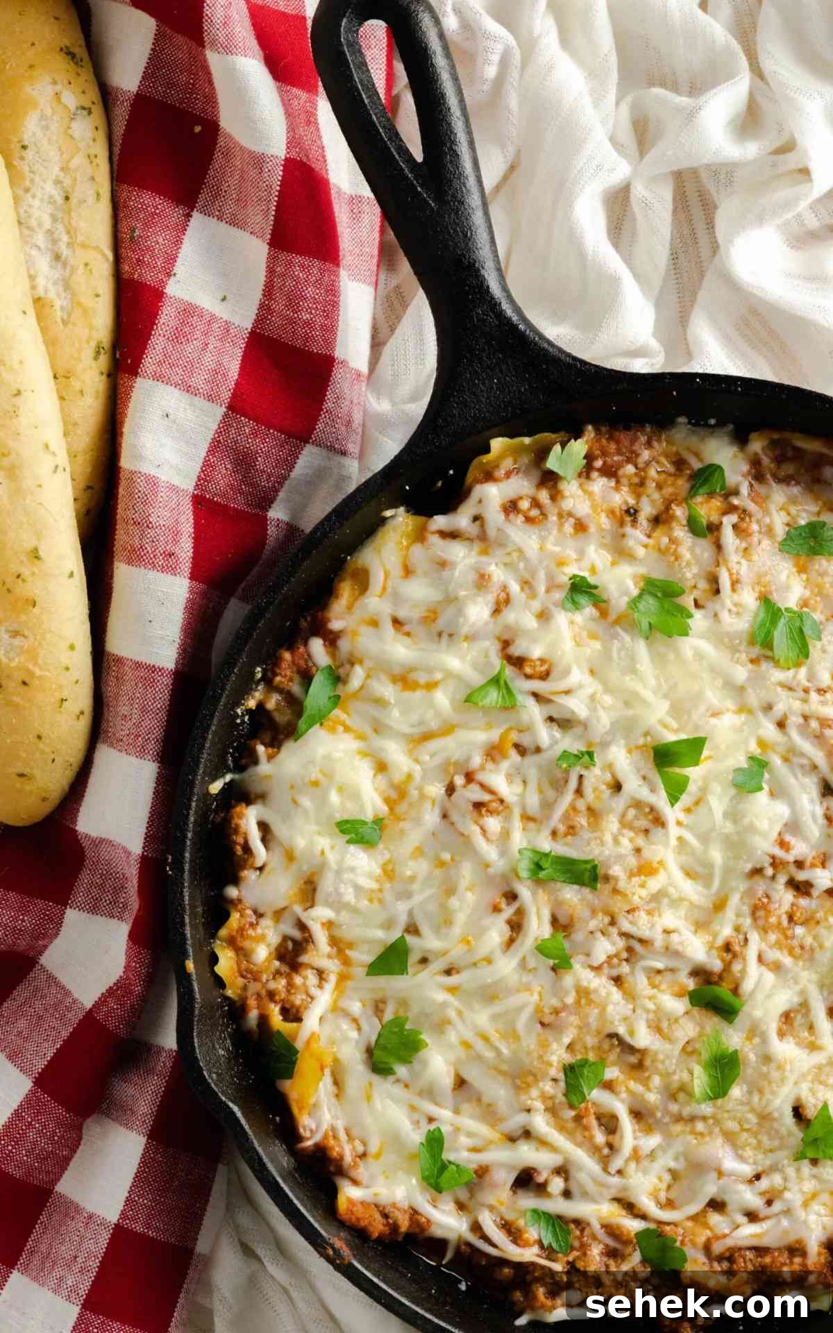 One-Pan Skillet Lasagna: Quick Weeknight Pasta Bake 5 Skillet lasagna baked in a cast iron skillet.