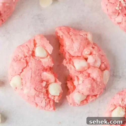 Pink and white cookies with white chocolate chips.