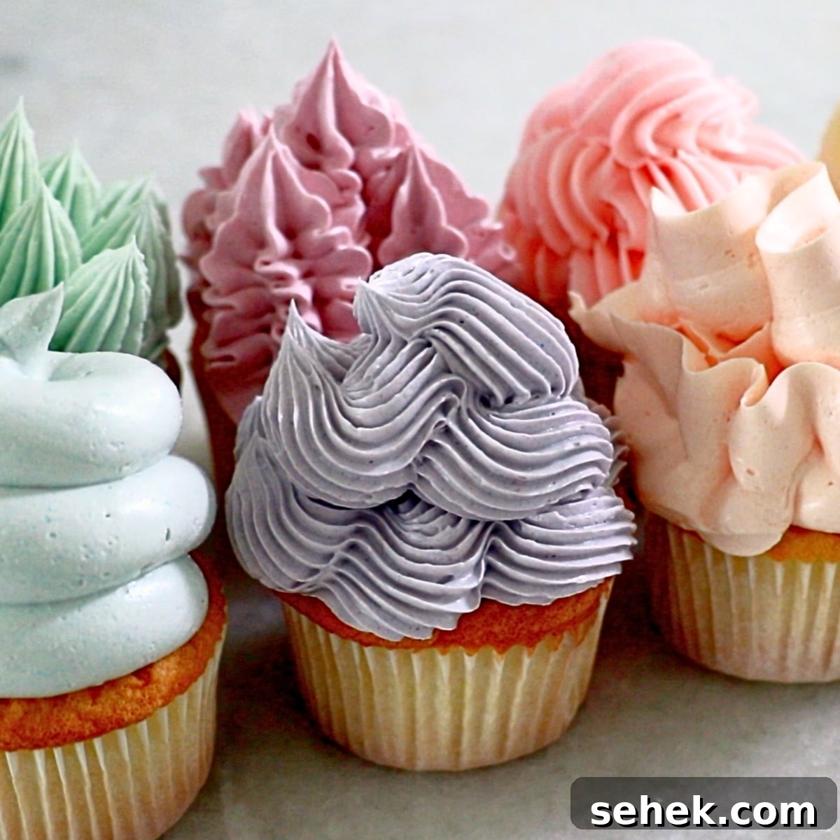 cupcakes frosted with airy Italian buttercream