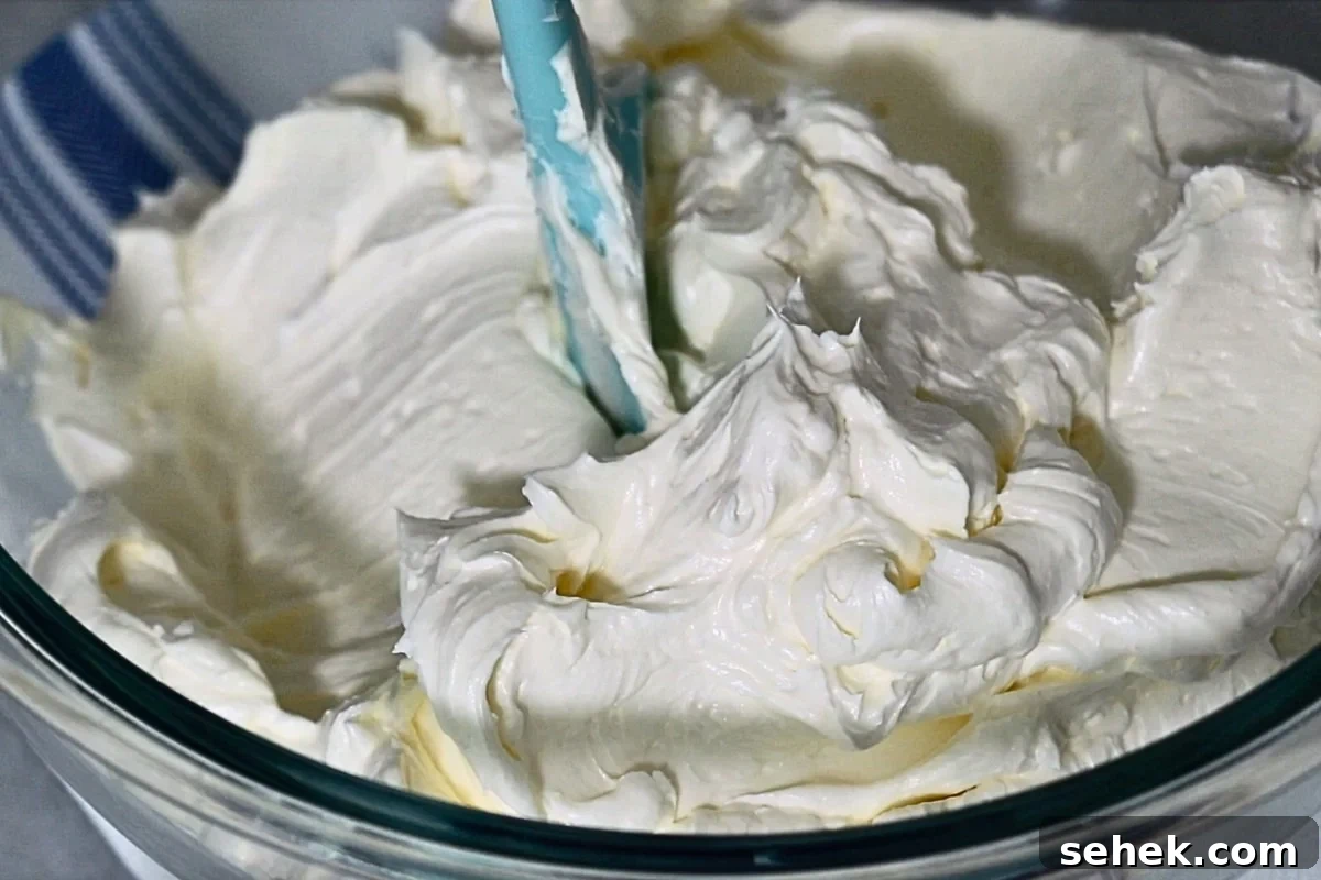 Authentic Italian Buttercream Recipe: Smooth, Silky Frosting Guide 9 airy and velvety Italian buttercream in a bowl