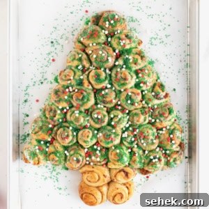A pull-apart cinnamon roll shaped like a Christmas tree.