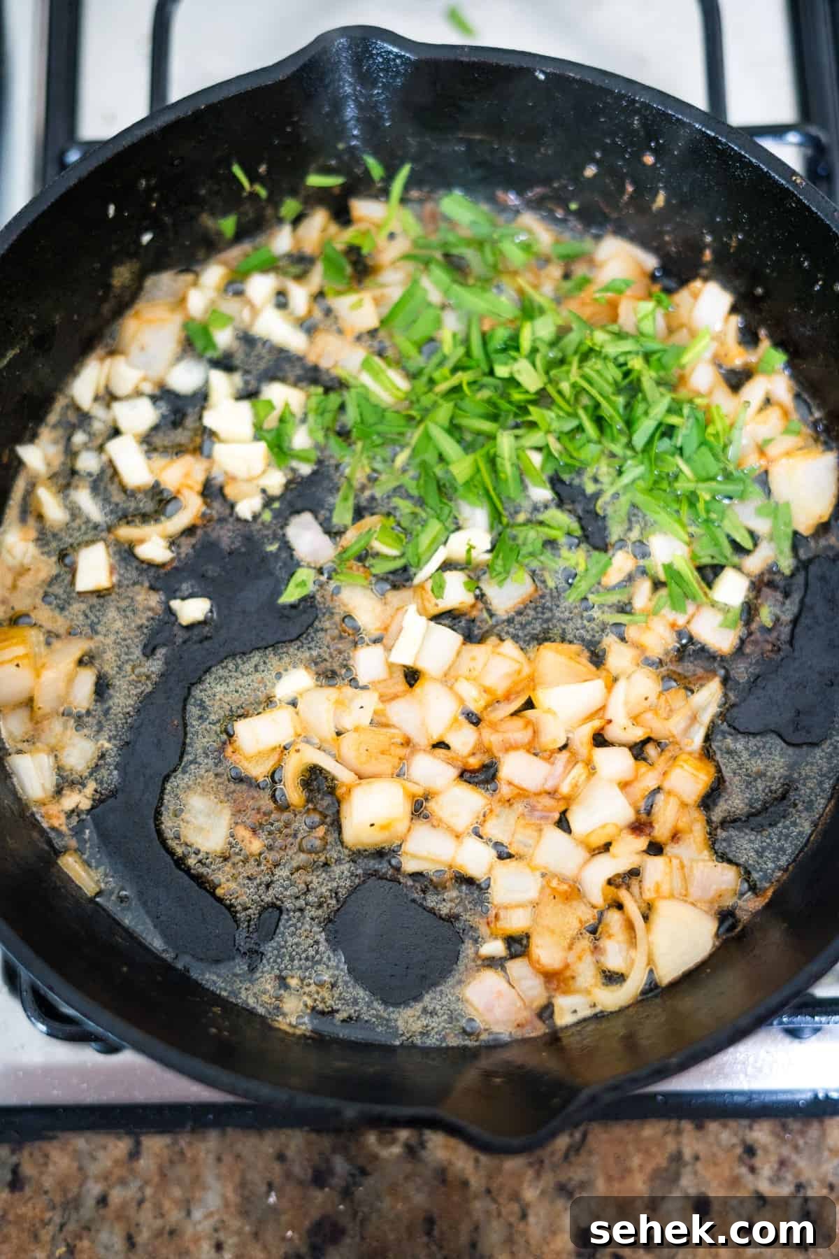Creamy Tarragon Chicken Skillet with Lemon and Garlic 6 A tarragon chicken frying pan on a stove.