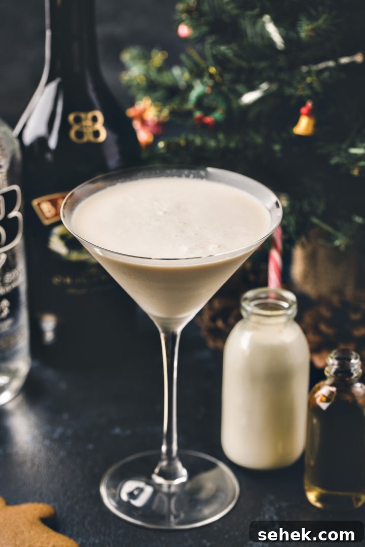Gingerbread Martini Recipe: Festive Christmas Cocktail Guide 2 photo of a gingerbread martini in front of a christmas tree