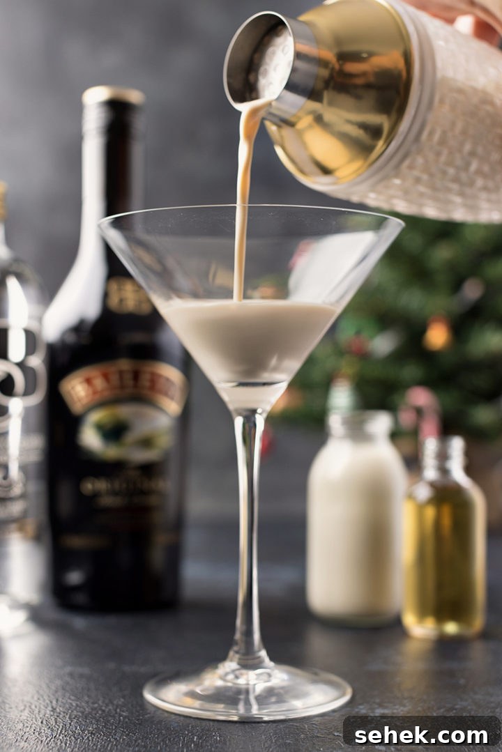 Gingerbread Martini Recipe: Festive Christmas Cocktail Guide 6 photo of pouring a shaker of a gingerbread martini into a cocktail glass