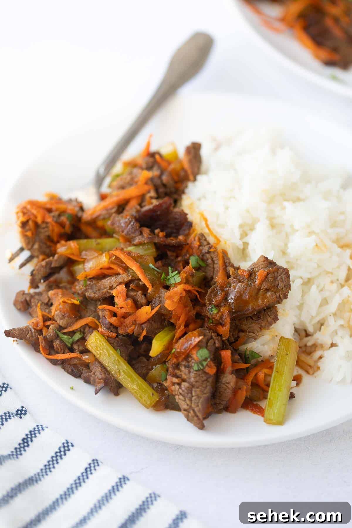 Beef Stir-Fry beef stir fry on a plate with white rice