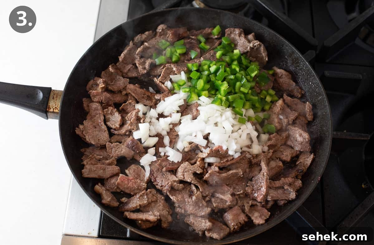 Sizzling Beef Stir-Fry with Shredded Vegetables and Ginger 6 Beef cooking in a skillet