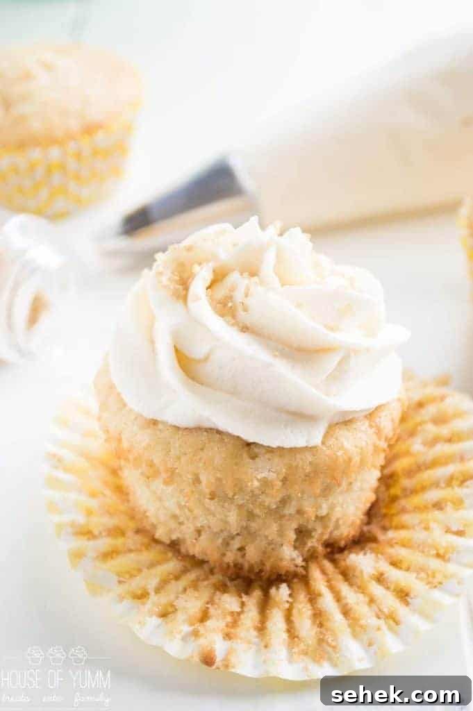 Vanilla cupcakes cooling on a wire rack.